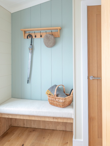 Light-filled hallway with a calming contemporary coastal colour scheme.