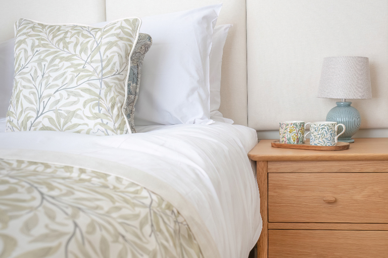 Soft fabrics and beautifully textured furnishings creating a relaxing master bedroom.
