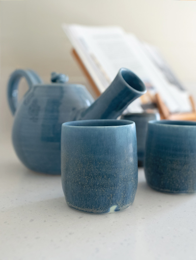 Handmade ceramic teapots and cups adding a stylish finishing touch to the kitchen.