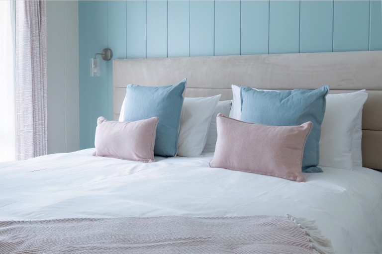 The Sandpiper second bedroom with refined coastal-inspired interiors and beautifully coordinated furnishings.