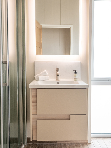 The Sandpiper main bathroom featuring luxury fittings and sophisticated styling.