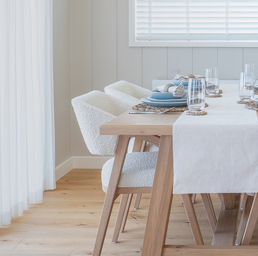The Shearwater lodge dining area with elegant beach-inspired interiors and open-plan living.
