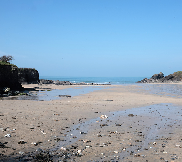 Trevone Bay with golden sand, rocky shoreline and Atlantic Ocean