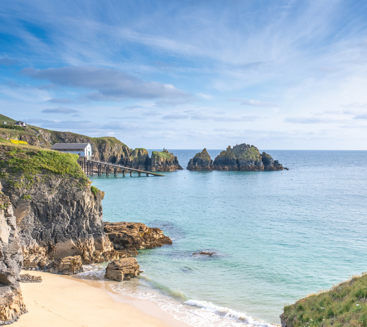 A wonderful view across Mother Ivey's Bay to the lifeboat house and the Merope Rocks